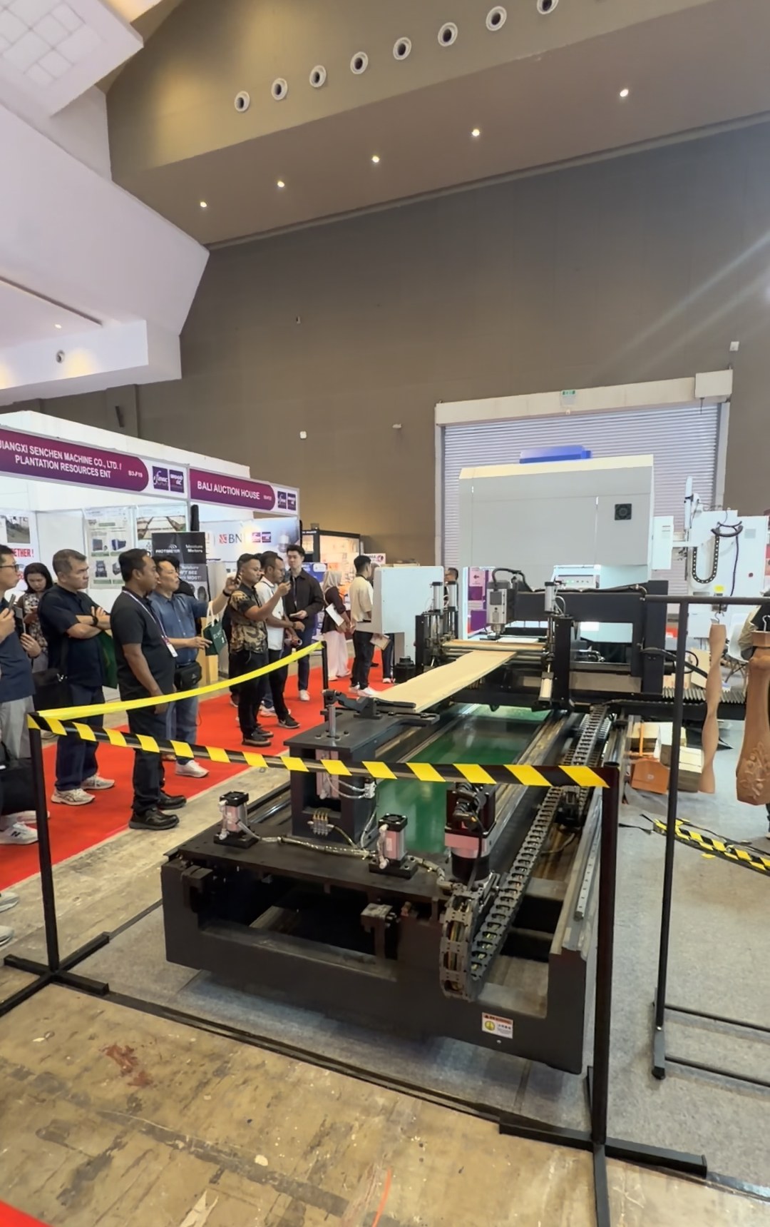 Customers watch the cutting process at the booth.