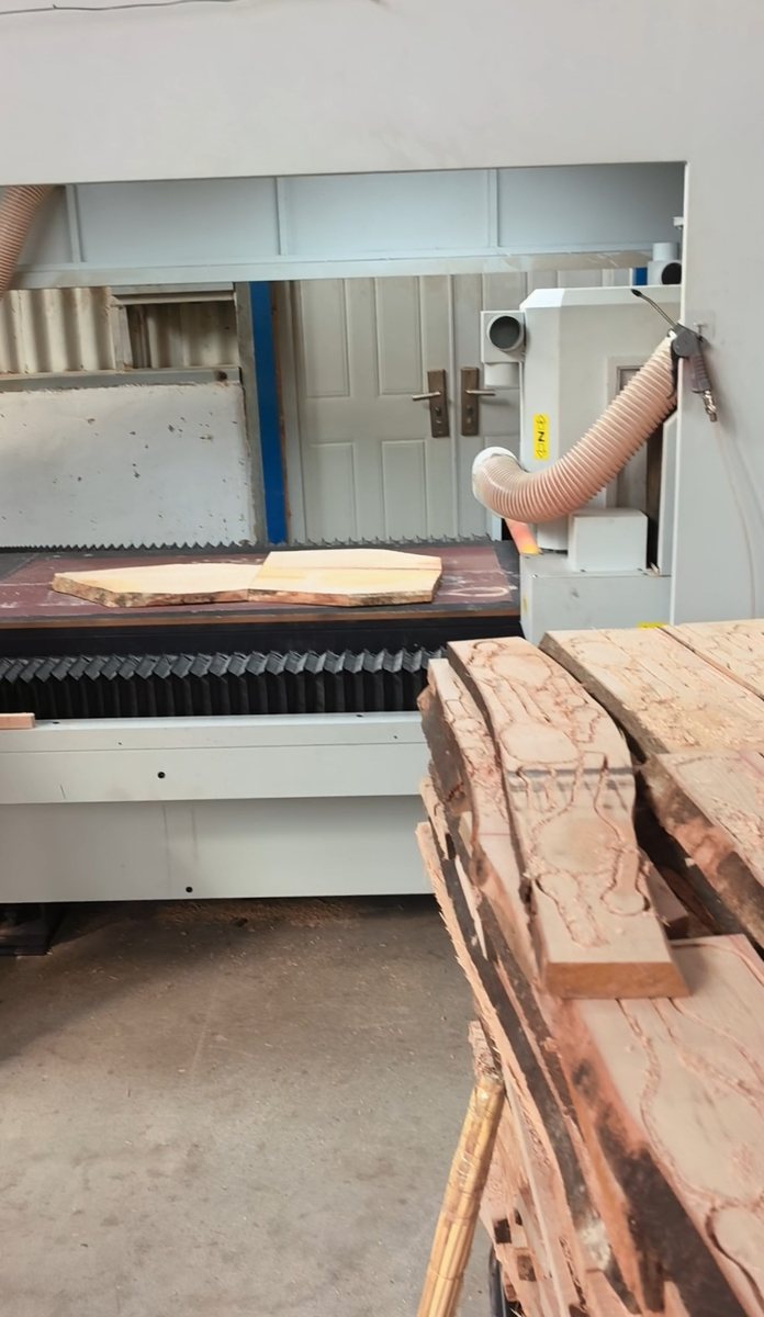 Two smaller boards arranged together on one CNC worktable.